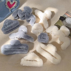 Large plush claw clip set in grey and beige faux fur for elegant women hair styling