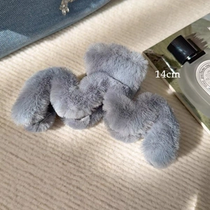 Detail view of 14cm large plush hair claw clip in grey with soft faux fur texture