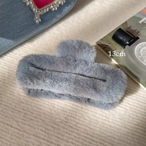 Close-up of a 13cm large grey plush hair claw clip with soft faux fur texture