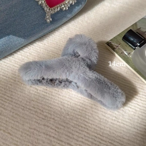 Macro detail of 14cm large grey plush faux fur hair claw clip for thick hair styling