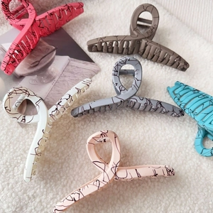 Matte finish large shark hair clips in six colors with stylish black ink splatter pattern