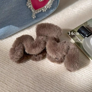Detail of 14cm large plush hair claw clip in coffee brown with soft faux fur texture