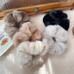 Set of four plush faux mink fur scrunchies in brown, tan, black, and cream white colors
