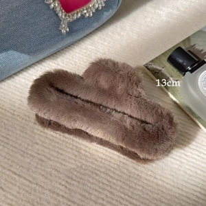 Detail of 13cm large brown plush hair claw clip showing soft faux fur texture