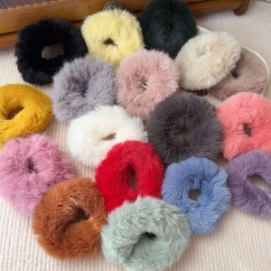 Fuffy plush scrunchies in various vibrant colors for ponytails and winter hair styling