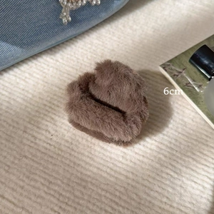 Close-up of a 6cm dark brown plush shark hair claw clip for autumn and winter styles