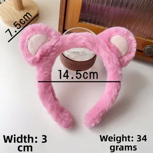Vue détaillée du bandeau en peluche rose avec dimensions de 14,5 cm de large et un poids de 34 g