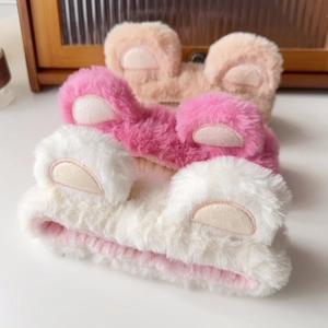 Three plush bear ear headbands in beige pink and white for face washing and makeup