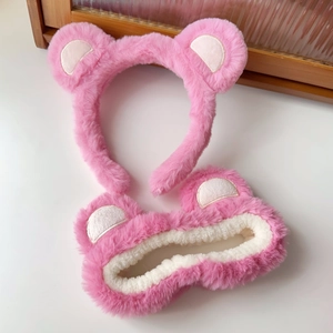 Detailed view of plush pink strawberry bear headband set with soft fleece texture
