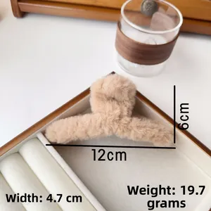 Detail view of plush claw clip showing 12cm length and 6cm height measurements