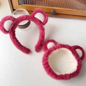 Macro shot of plush strawberry bear headband set with pink fuzzy textures for skincare