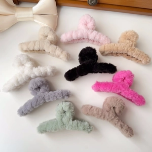 Detailed overhead view of plush faux rabbit fur hair claws in various Morandi colors