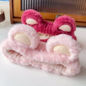 Close-up of pink and rose plush headbands with soft faux fur texture and cute animal ears