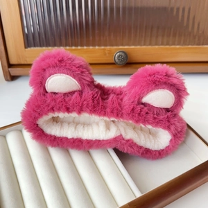 Detail view of pink plush animal ear headband in jewelry box for face washing