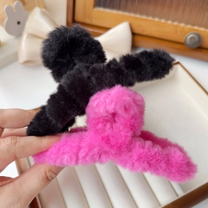 Elegant plush shark hair claw clips in black and rose red with soft faux fur texture