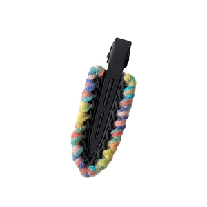 Contrast knitted yarn hair clip with colorful rainbow weaving on black duckbill base