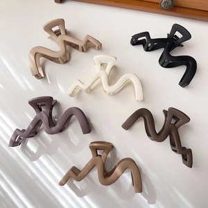 Set of large matte wavy hair claws in assorted neutral tones and Morandi colors