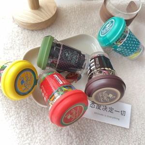 Macro shot of colorful hair elastic bands in creative mini coffee cup packaging