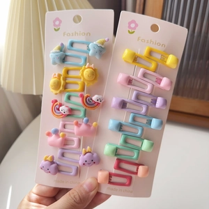 Détail de 20 barrettes colorées macaron pour enfants avec motifs de dessins animés