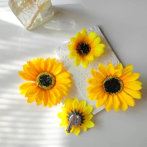Set of 4 artificial sunflower hair clips and brooches with metal duckbill clips on stone