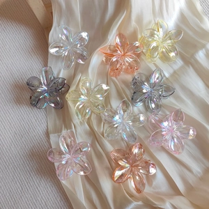 Chic transparent iridescent plumeria flower hair claws in multiple gradient pastel colors