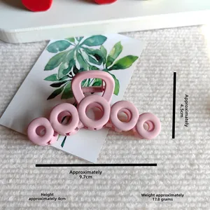 Detail view of pink matte hollow circle claw clip with size dimensions shown