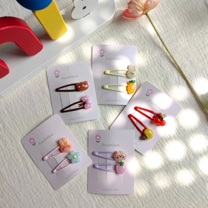 Close-up of 5 sets of cartoon children's hair clips featuring rabbits and bears