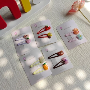 Cute cartoon hair clip set for girls featuring rabbits and flowers on pink display cards