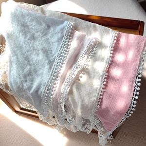 Pastel lace headscarf set with delicate tassels and bohemian textures in soft lighting