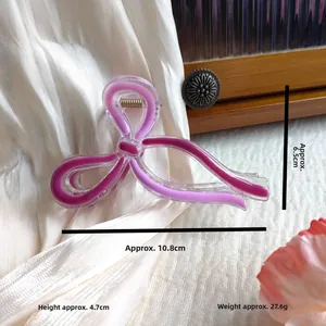 Detailed view of 10.8cm butterfly hair claw clip showing dimensions and smooth pink finish