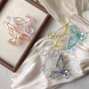Iridescent bow-shaped hair claw clips set in six vibrant laser colors for women