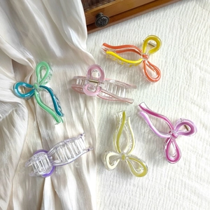 Elegant large butterfly resin hair claw clips in assorted pastel colors with metal spring