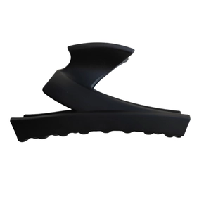 Minimalist matte black Z-shaped claw clip with hollow circular design for women