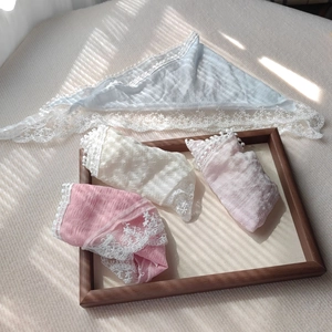 Detailed lace texture and soft colors of four translucent triangle hair scarves