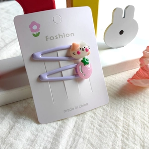Detailed set of purple BB hair clips with cartoon cat and strawberry resin charms