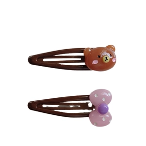 Cute kids hair clip set featuring a brown cartoon bear and a pink polka dot bow decoration