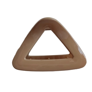 Minimalist cream triangular hollow hair claw clip with glossy finish for women's updos