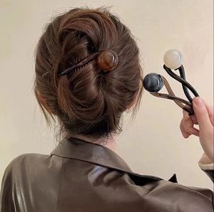 Minimalist pearl twist hair claw clips in amber brown, marble blue and cream white colors