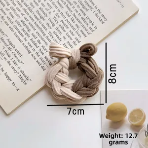 Detailed view of bicolor woven hair scrunchie with knit texture and size dimensions