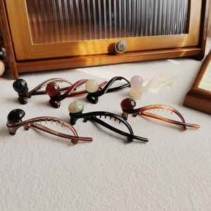 Set of 6 vintage resin hair claws in brown and amber tones with pearl details