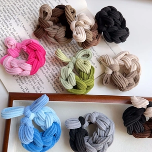 Detailed view of high-elastic braided hair ties with thick ribbed fabric and spiral texture
