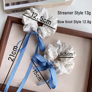 Floral print scrunchie set with blue salt patterns and ribbon for bun hairstyles