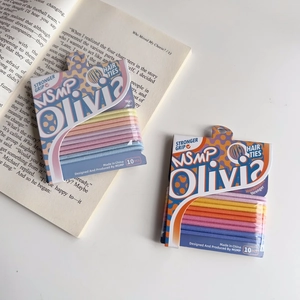 Detail of 10-piece high-elastic candy-colored seamless hair ties set on a book