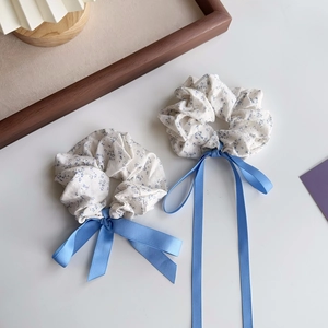 Sea salt blue floral scrunchie with a long bow ribbon for elegant bun hairstyles