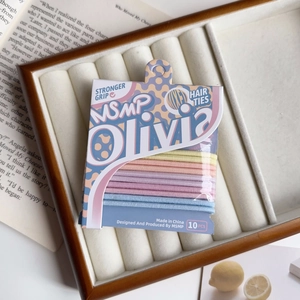Detailed view of 10-piece high-elasticity candy-colored hair ties in a luxury velvet box