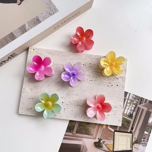 Detailed set of six colorful floral acrylic hair claws in vibrant gradient pastel shades