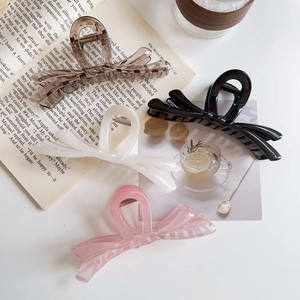 Pinces à cheveux élégantes en forme de nœud en couleurs thé transparent, noir, blanc et rose