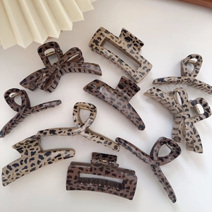 Brown leopard print claw clips set featuring vintage bow and cross styles for hair styling