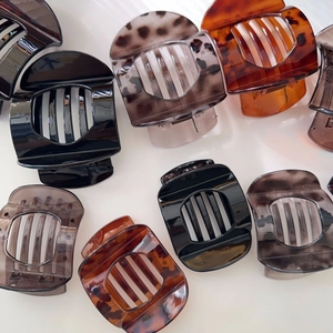 Large tortoiseshell hair claws in assorted colors for elegant hairstyling and firm grip