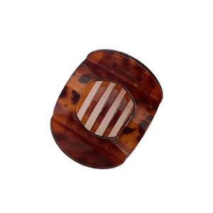 Large tortoise shell hair claw clip with vintage amber pattern for elegant hairstyling